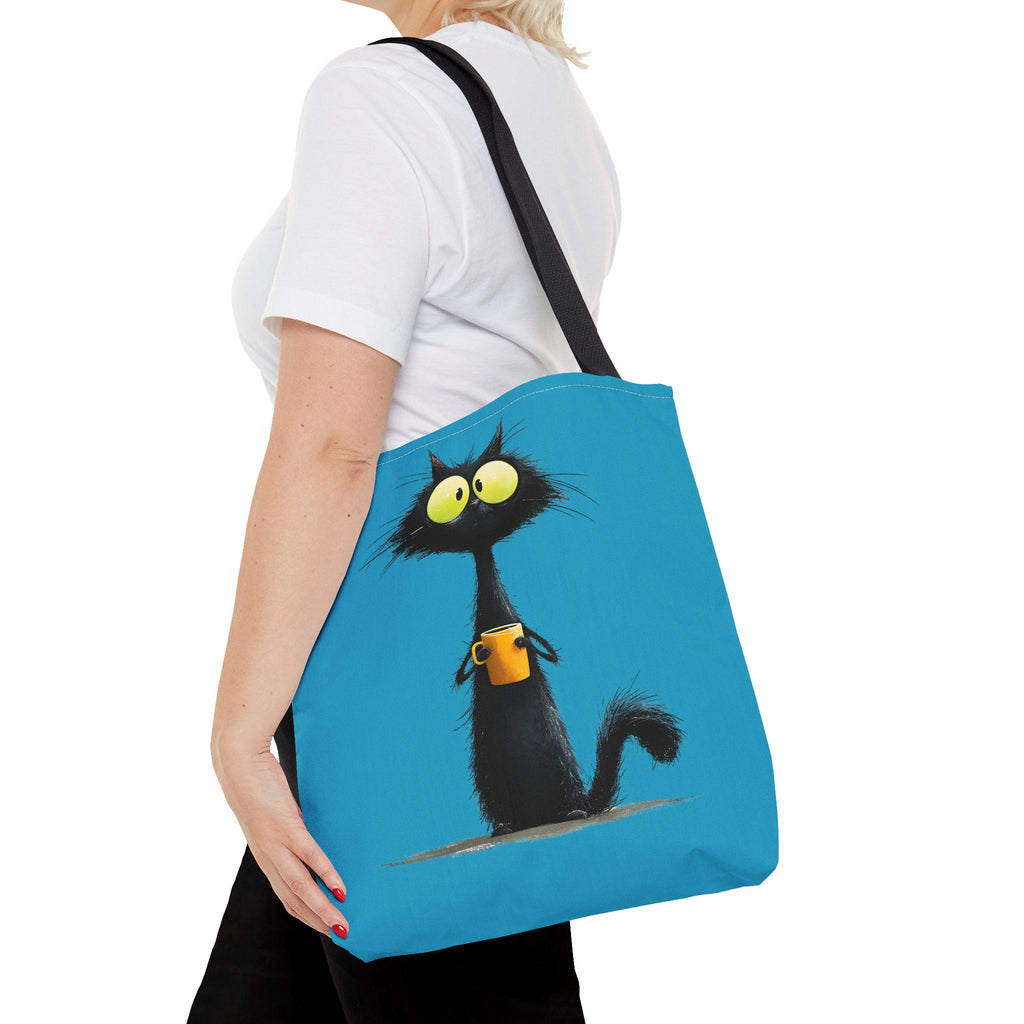 Wide-Eyed Black Cat Holding Coffee Tote Bag | Cute Cartoon Cat Illustration